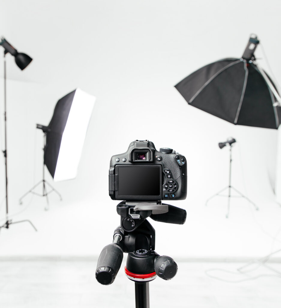 Empty photo studio with lighting equipment and camera Empty photo studio with lighting equipment and camera